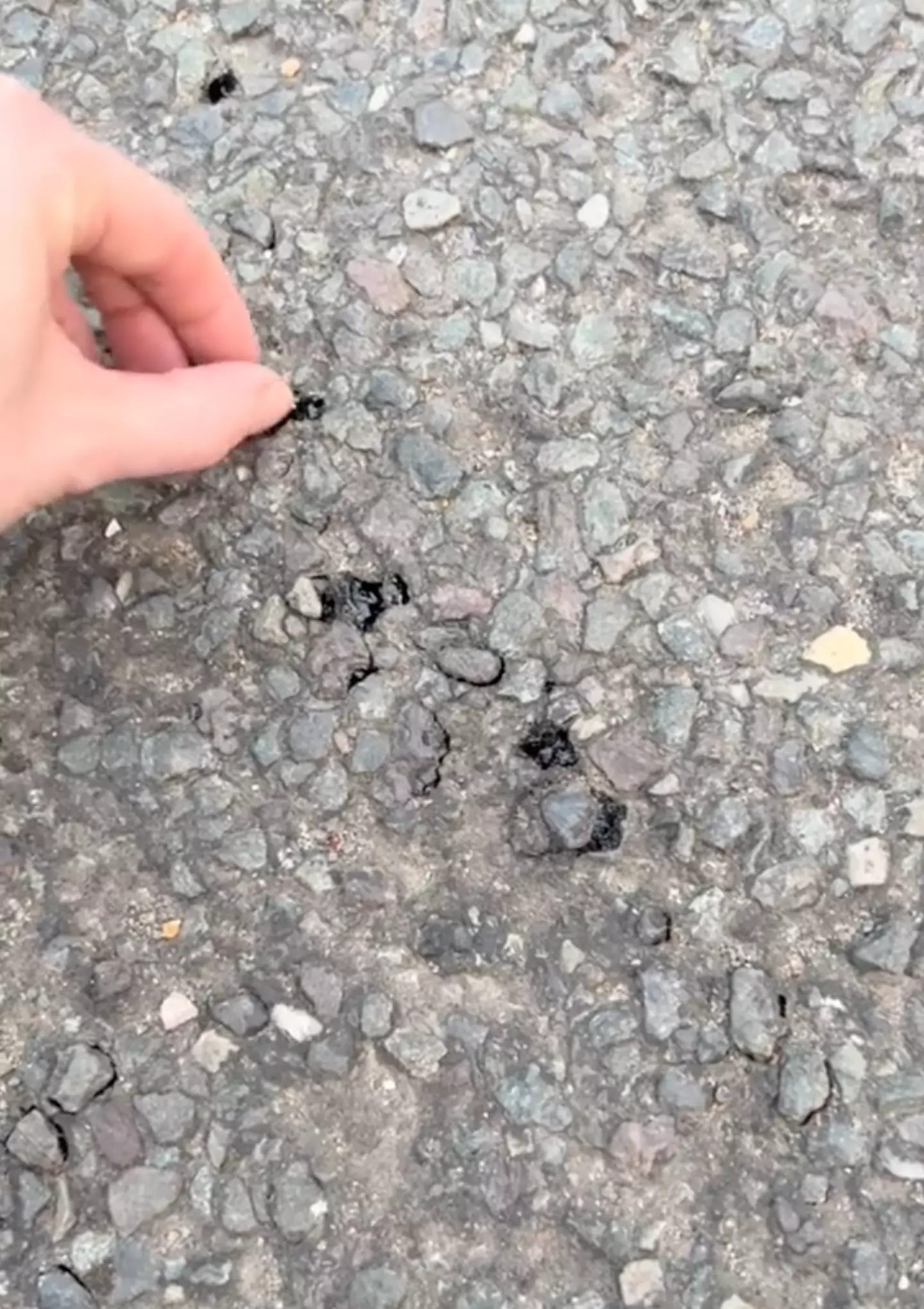 One TikTok user was able to pick the road apart after it had 'melted'.
