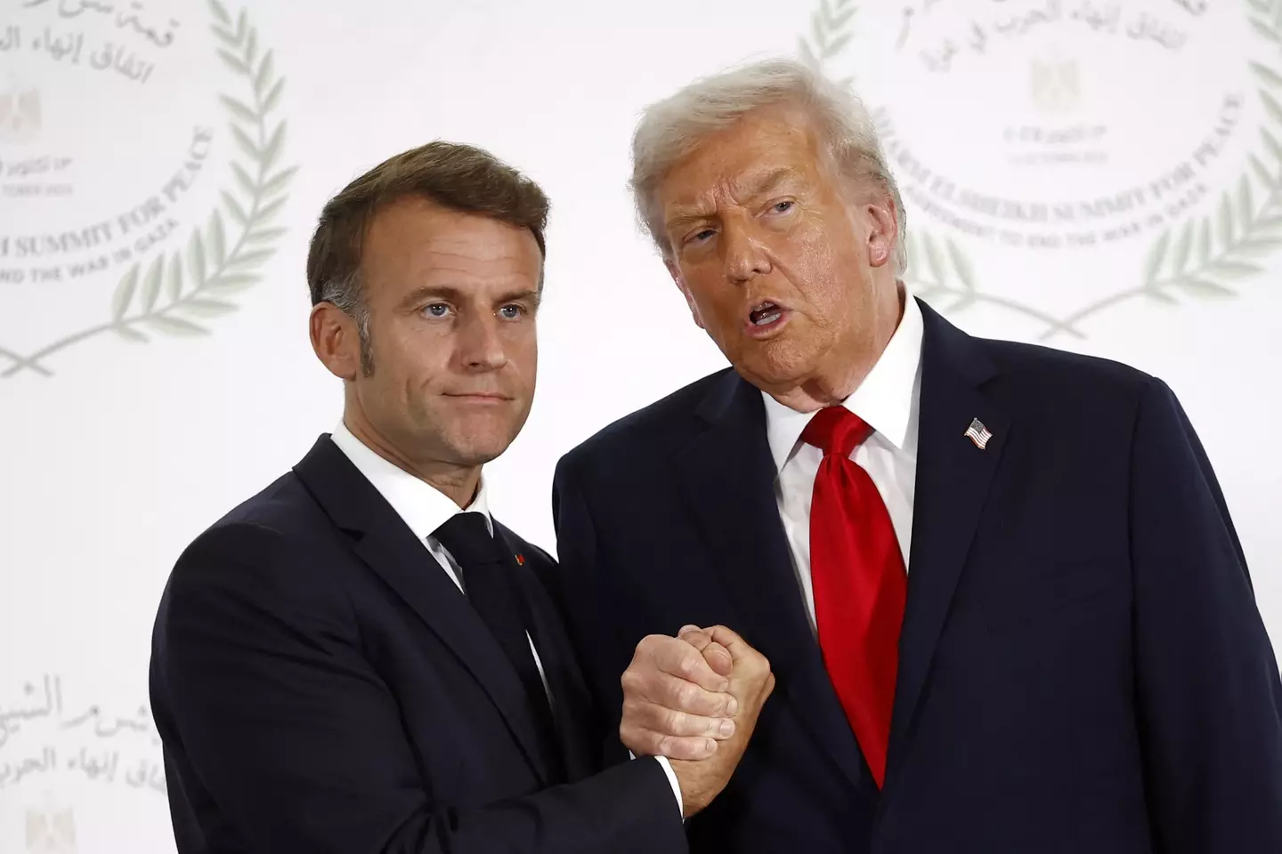 The pair shook hands for nearly half a minute. (YOAN VALAT/POOL/AFP via Getty Images)