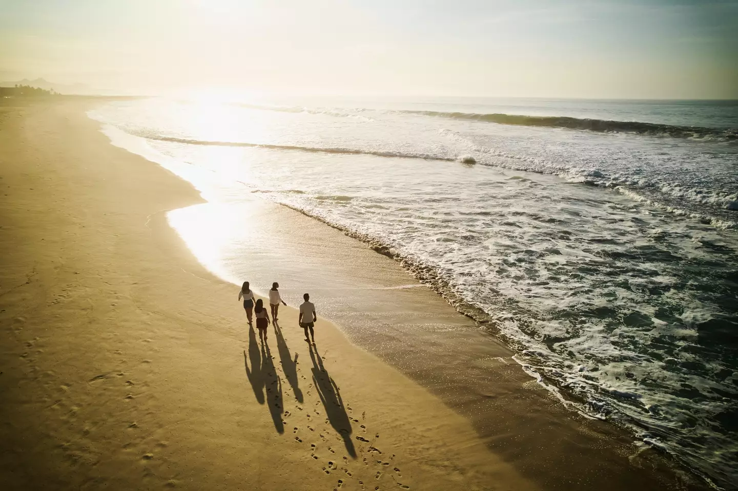 Not much beats a tranquil beach walk on holiday. (Getty Stock Photo)