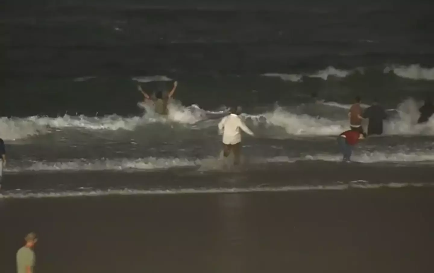 The presenter was seen rushing into the waves to help rescue the ten-year-old (7News)