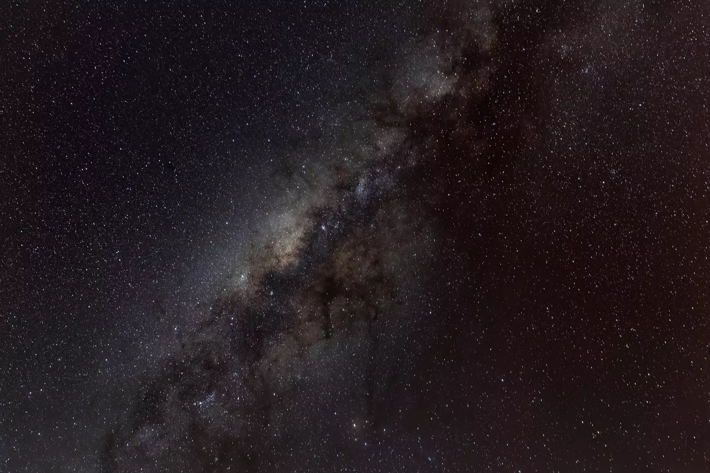 The Milky Way (pictured) could merge with its fellow galaxy if they do collide, but the Earth probably won't be here to see it anyway (John Moore/Getty Images)