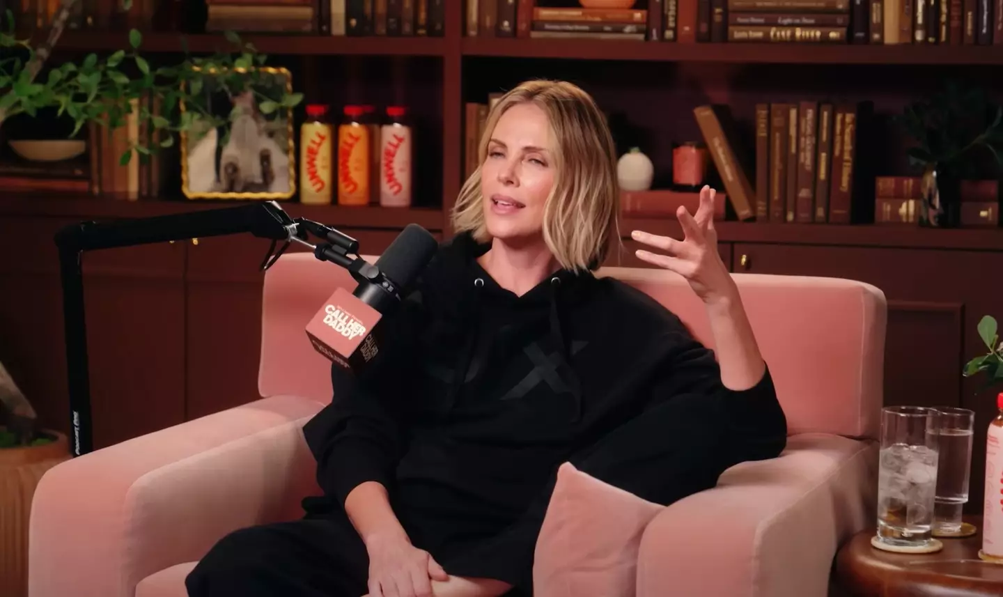 Charlize says it's not to protect the director, but to prevent him becoming the story (YouTube/Call Her Daddy)