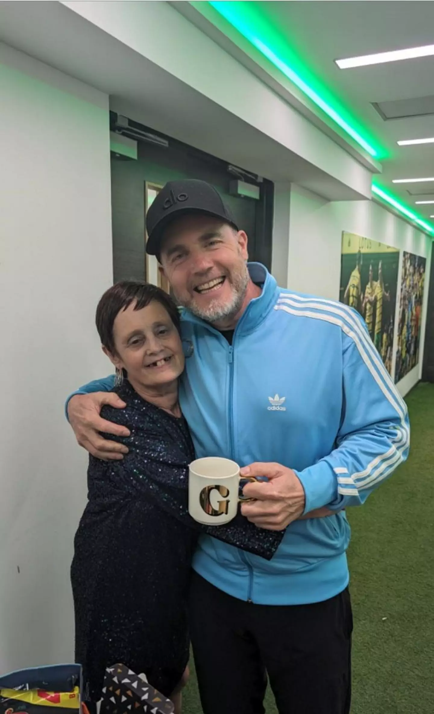 Janet brought gifts of mars bars, a mug and a Milk Tray for Gary and the boys. (SWNS)