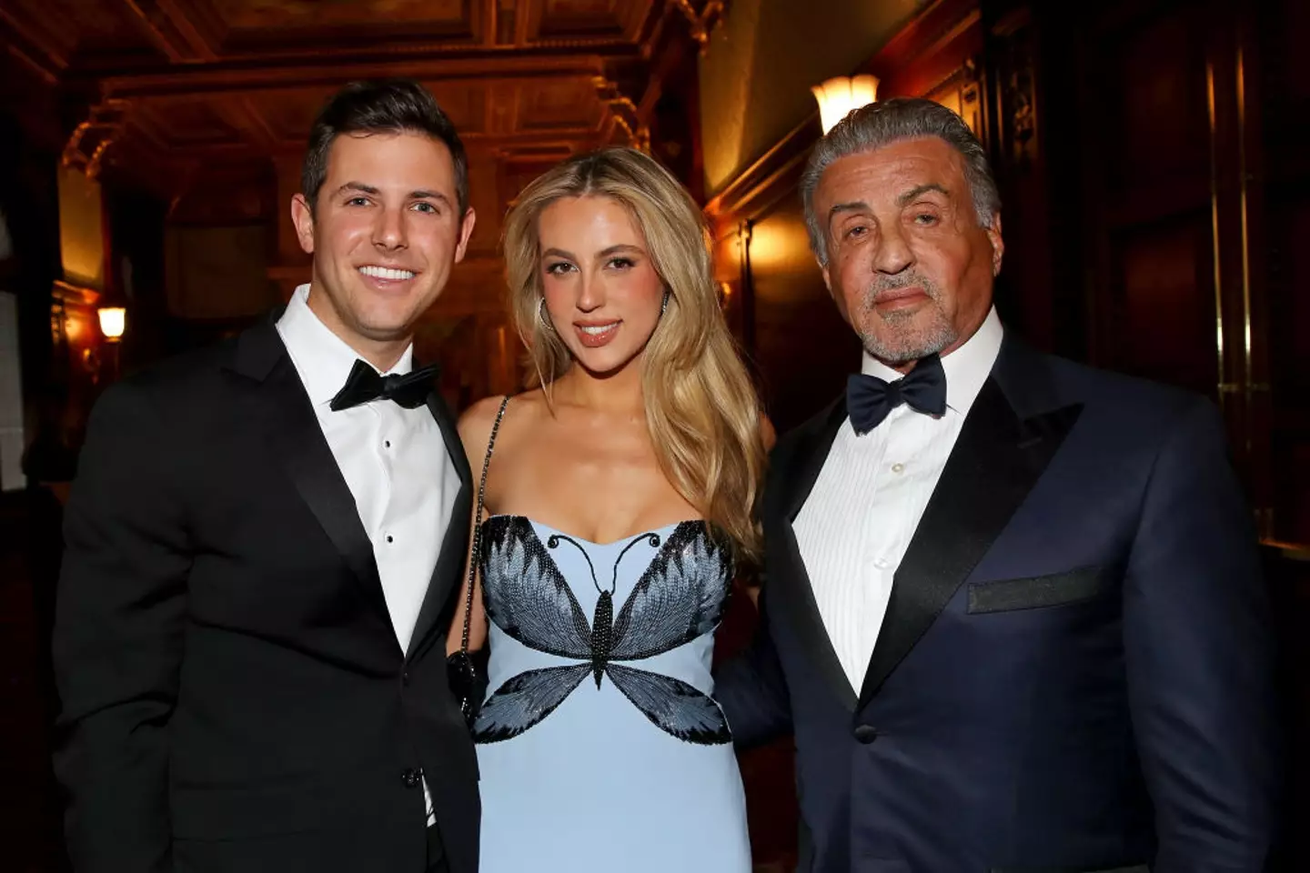 Stallone grabbed his hand (Tasos Katopodis/Getty Images for The Dwight D. Opperman Foundation)