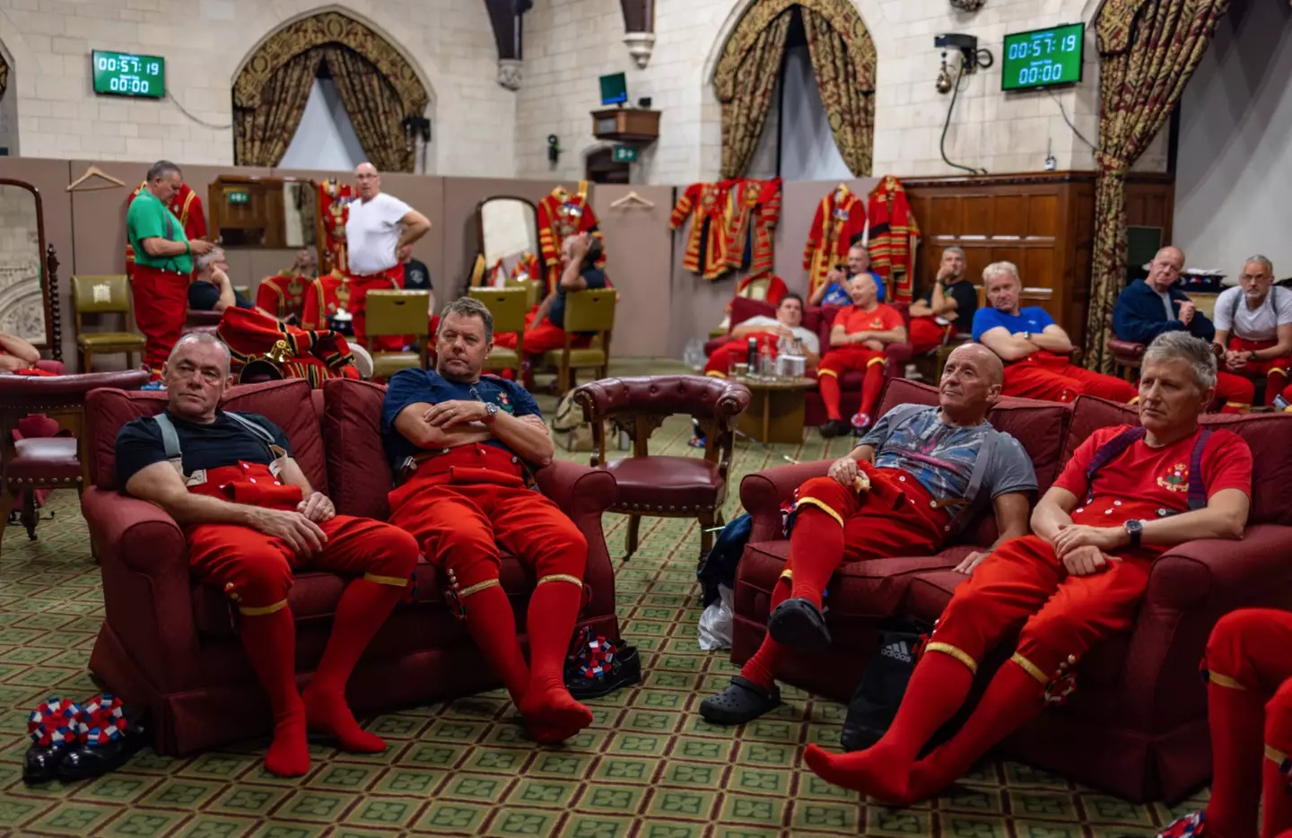 The beefeaters take a break during their work guarding the Queen's coffin.