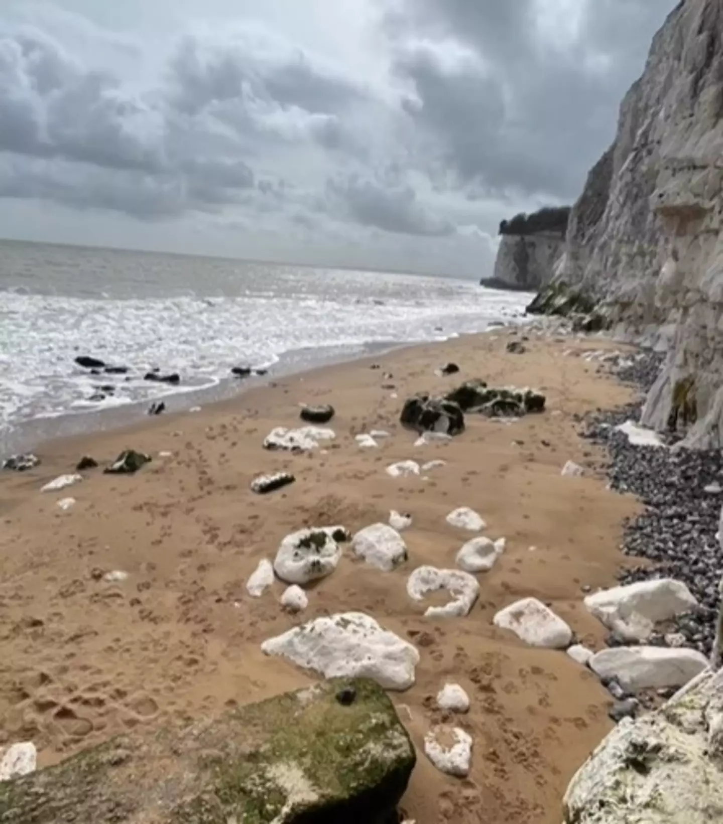 The model realised she was in trouble when she spotted that the tide coming in had blocked off her exit path.