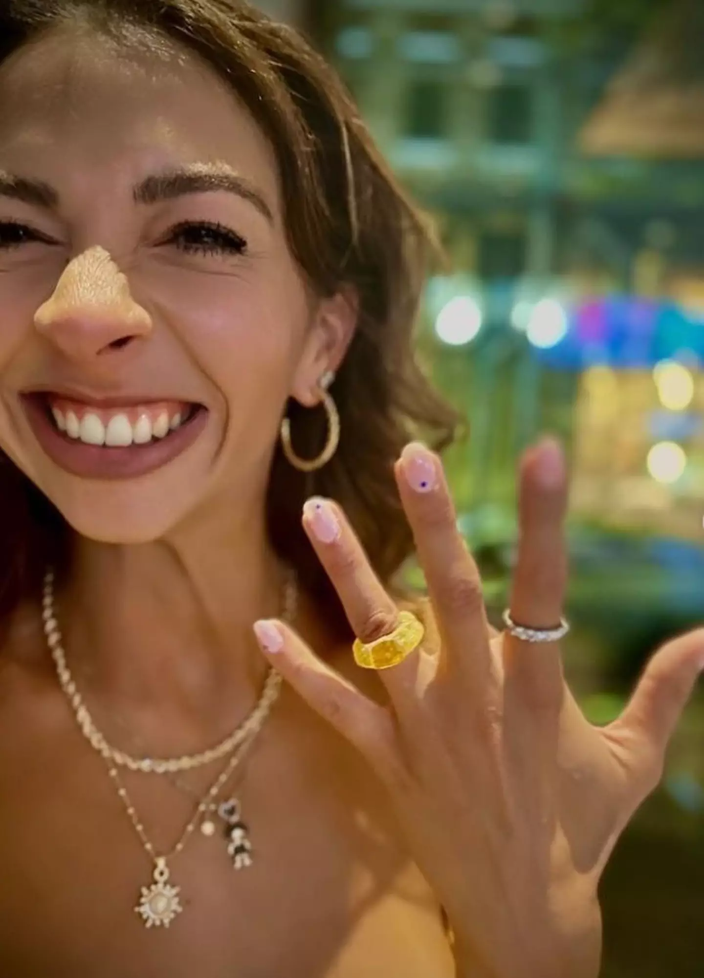 The bride-to-be showed off her 'hairdo' ring.