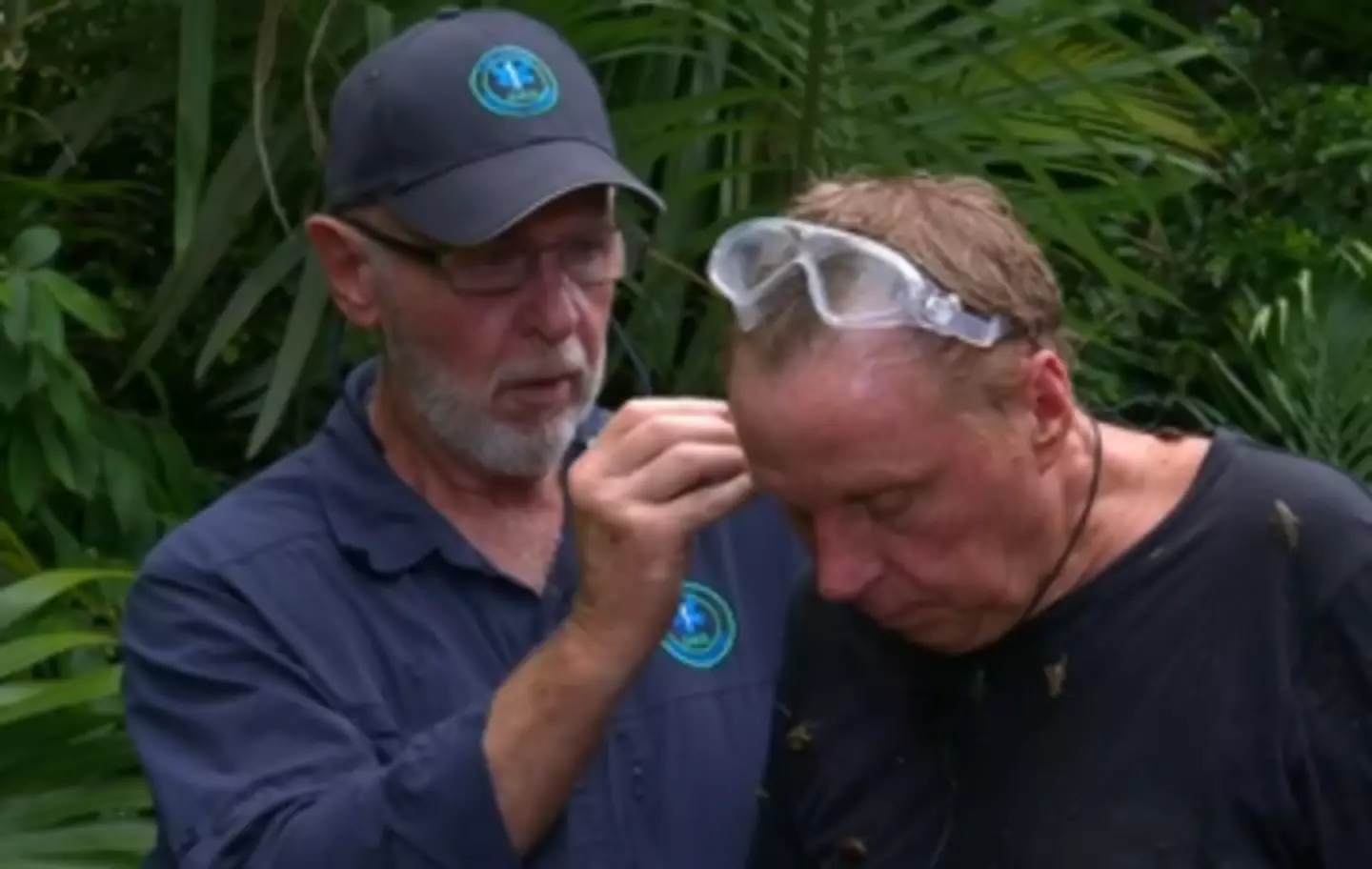 Medic Bob removing a cockroach from Harry Redknapp's ear.