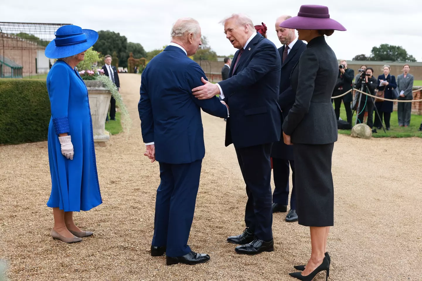 Bow your head, shake the hand if it's offered to you and don't keep touching them, that's the etiquette (IAN VOGLER/POOL/AFP via Getty Images)