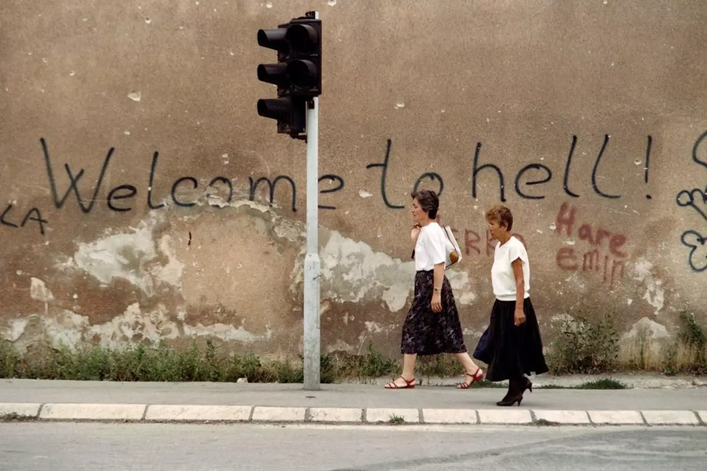 Graffiti written on the walls of Sarajevo's 'Sniper Alley' (GABRIEL BOUYS/AFP via Getty Images)