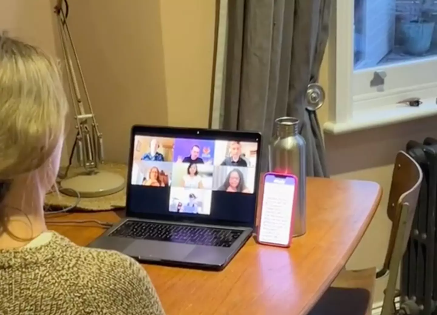 Placing the phone behind the camera would have avoided glancing to the side.