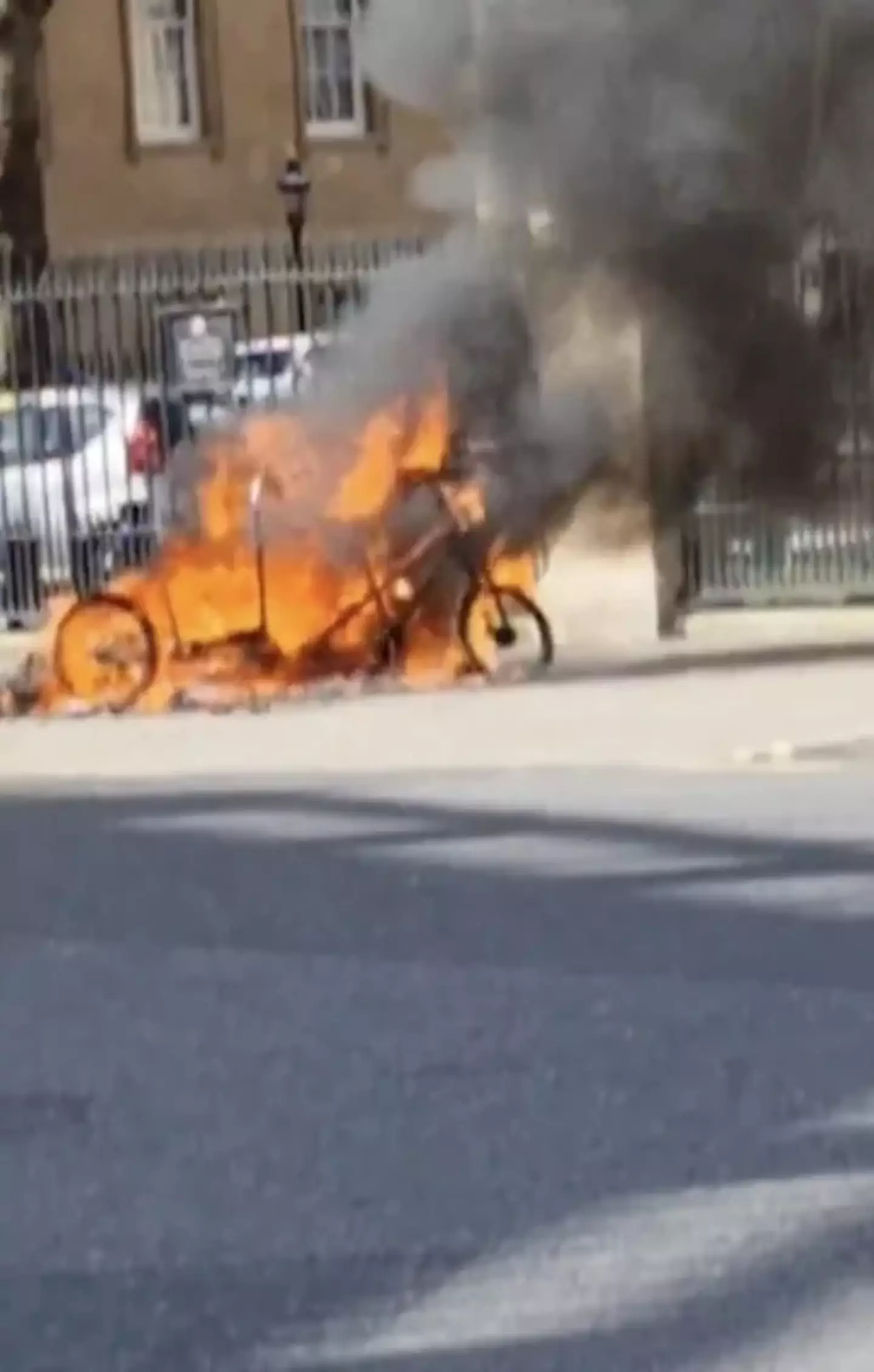 Videos show the pedicab engulfed in flames and billowing black smoke.