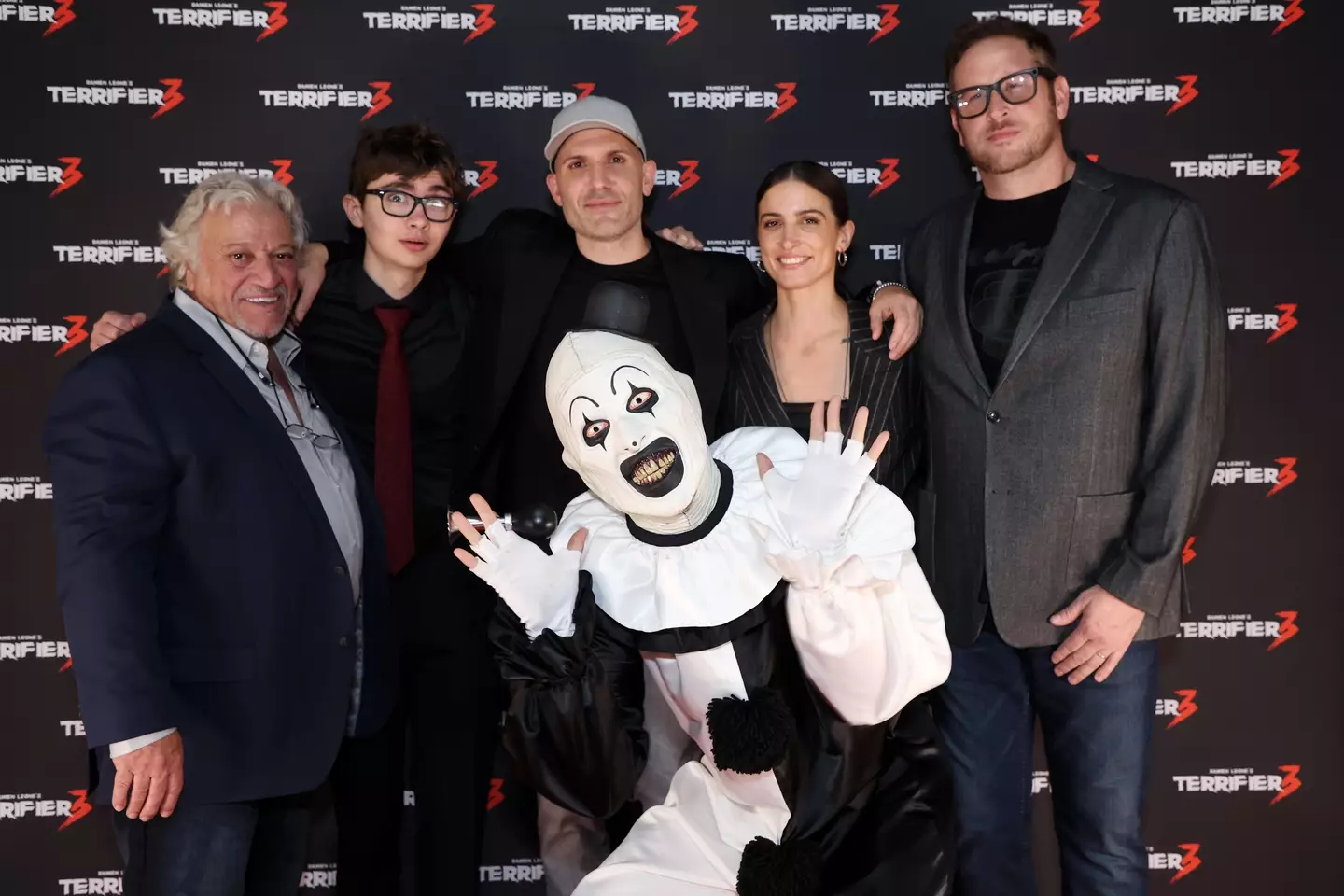 Phil Falcone (left) with the main cast and an Art the Clown impersonator (Lia Toby via Getty Images)