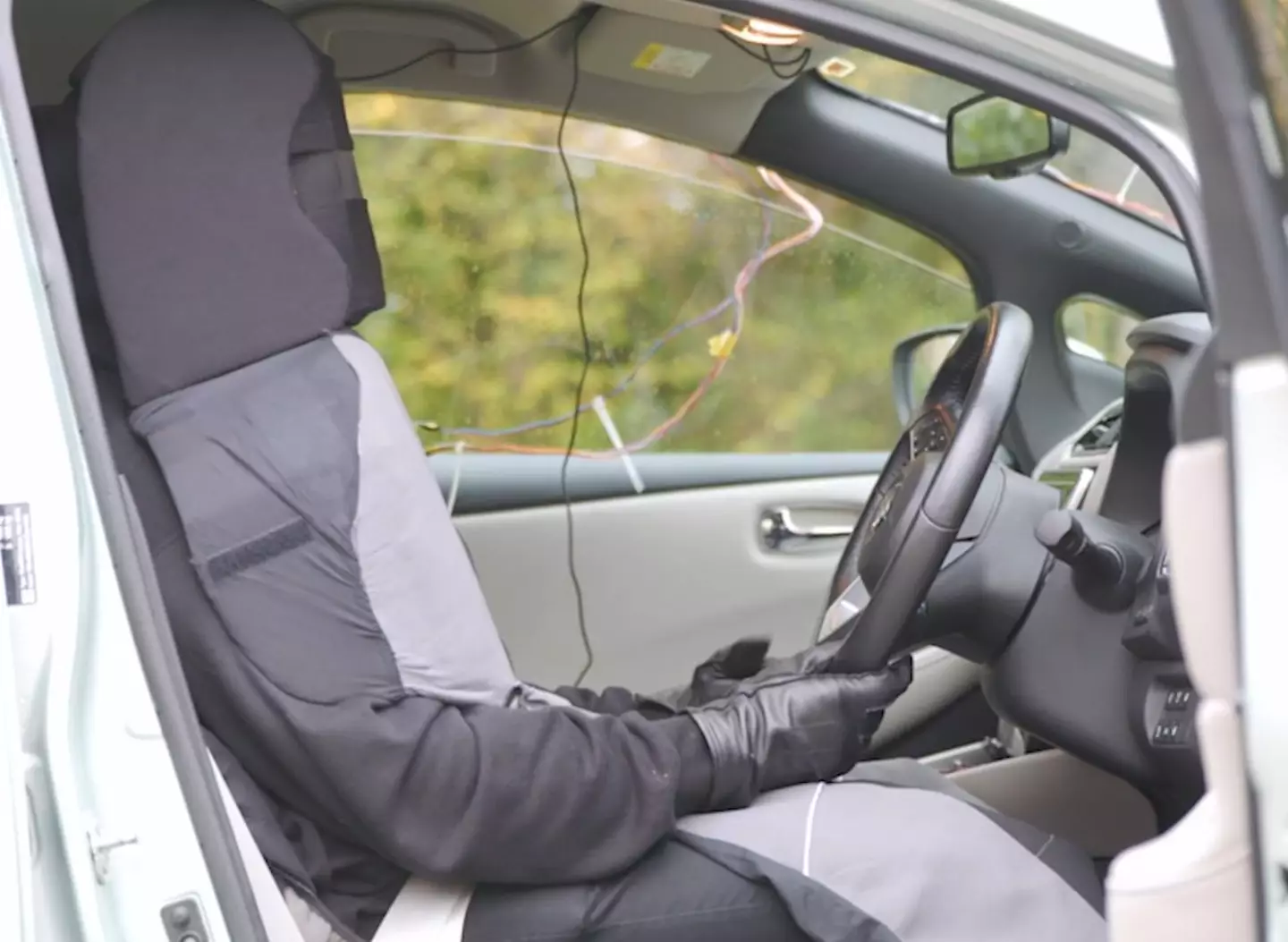 A ‘ghost-driver’ hid inside the seat to make it look as though the car was self-driving.