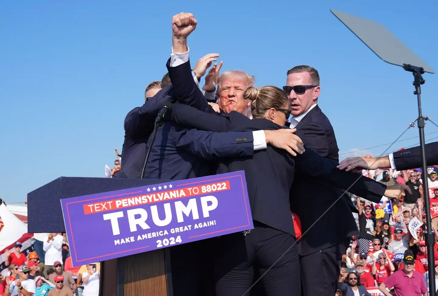 Trump fist pumped the crowd as he was taken away to safety. (Jabin Botsford/The Washington Post via Getty Images)