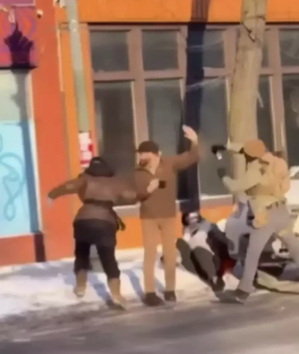 Pretti was seen clutching his phone in released footage (NBC News)