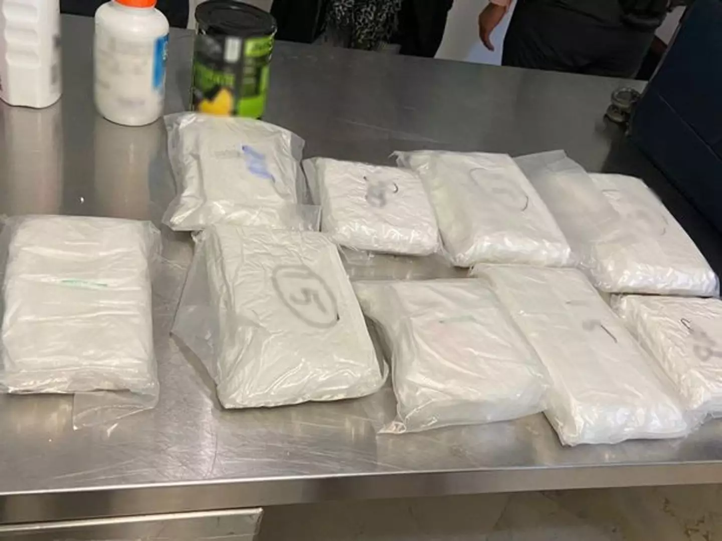 Police claim 10 kilos of powder with cocaine-like 'characteristics' were found.