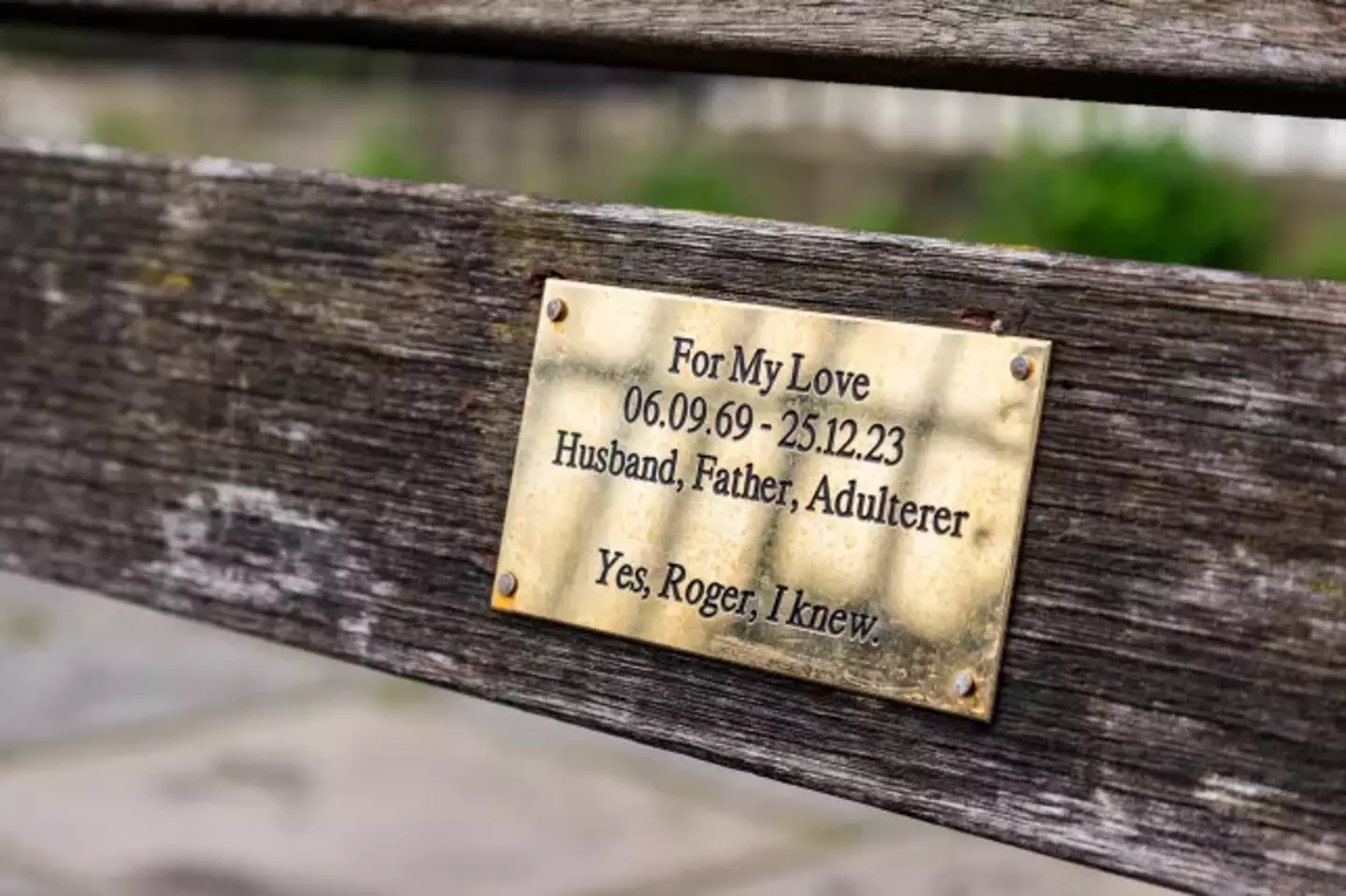 People reckon Banksy might be behind the plaque calling out a cheat named Roger.