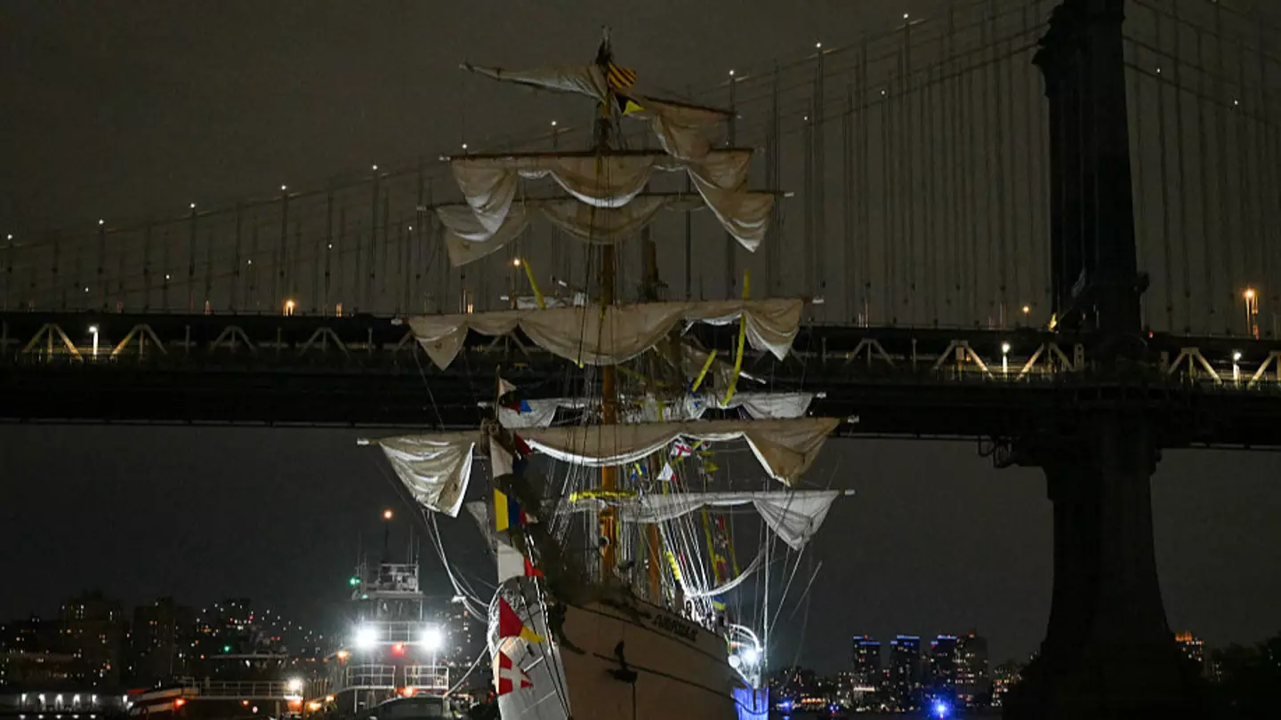 Sailors were seen hanging in air from mast as navy ship crashed into Brooklyn Bridge killing two people