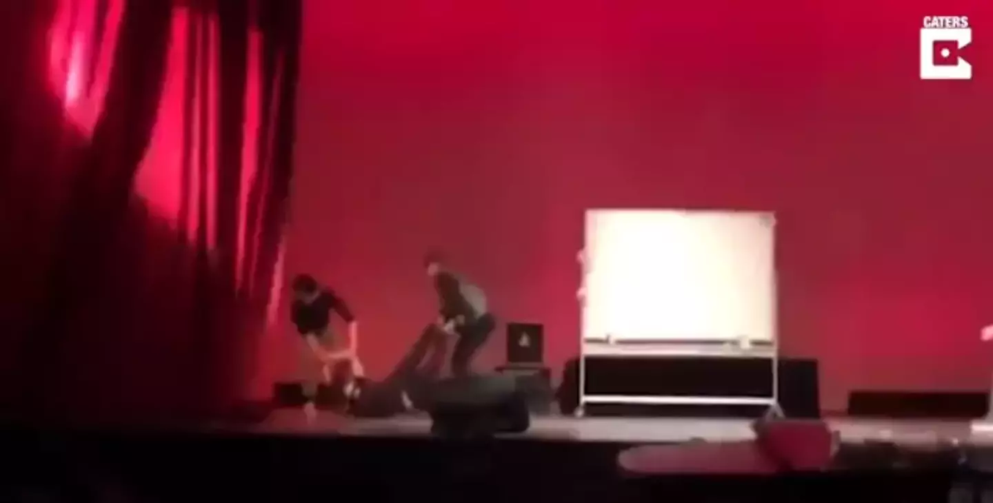 The assistant had to be carried off stage after pretending to faint.