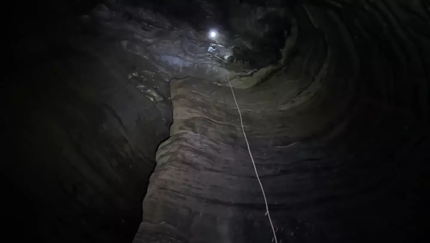 They had to drop 128 feet themselves, before lowering the GoPro even lower. (YouTube/ActionAdventureTwins)