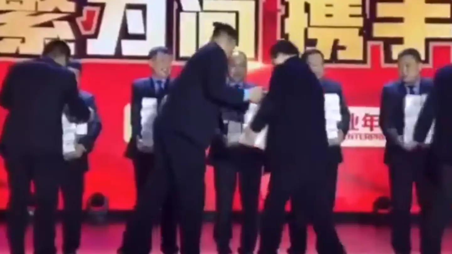 Staff struggled to hold the money on stage.