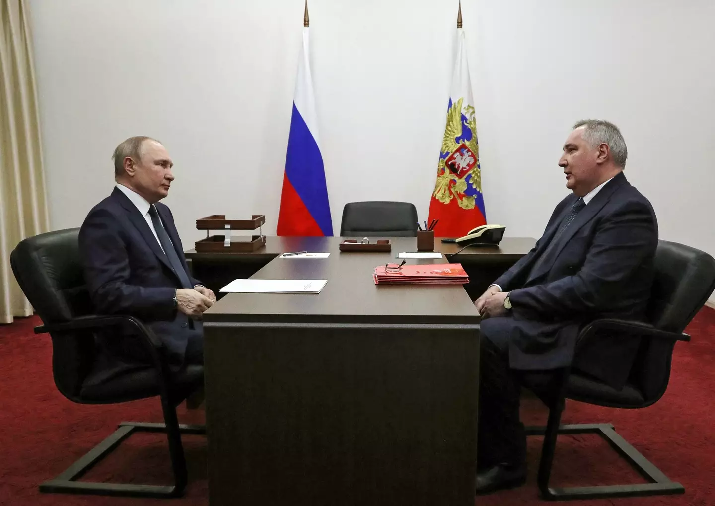 Putin and Dmitry Rogozin (MIKHAIL KLIMENTYEV/Sputnik/AFP via Getty Images)