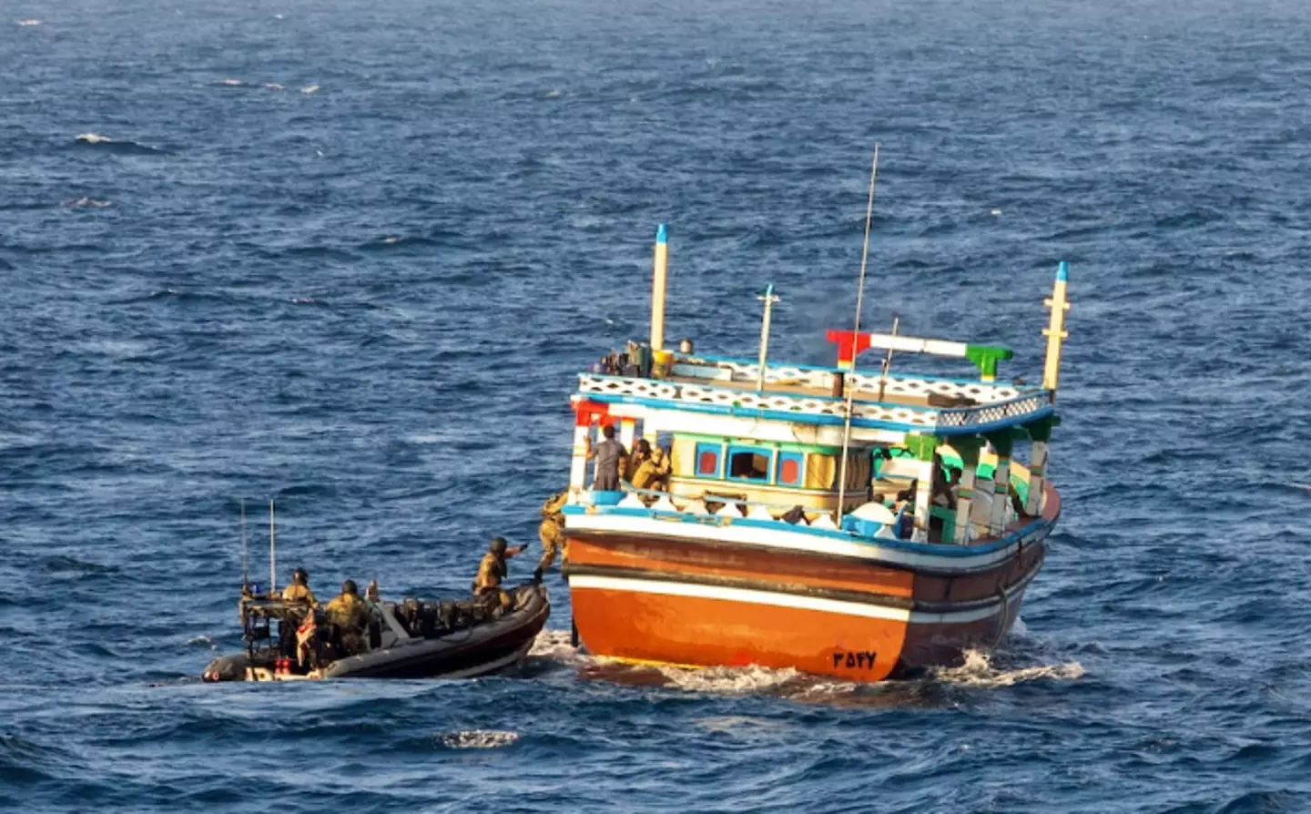 The crew of HMS Montrose boarding the suspect vessel.