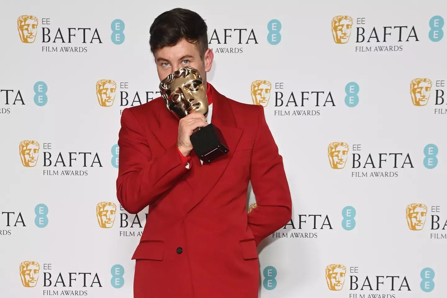 Barry Keoghan doing what everyone who wins a BAFTA ought to do, seeing if the award fits on their face like a mask.