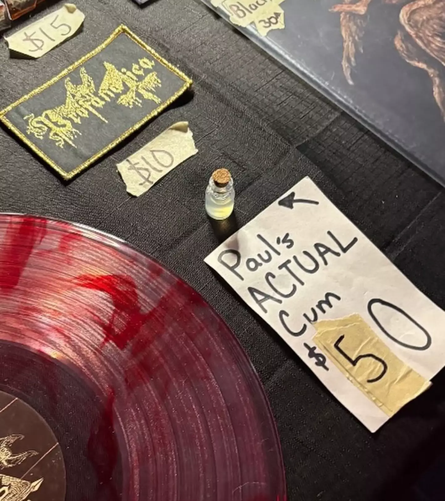 The merch table featuring the bodily fluid (X)
