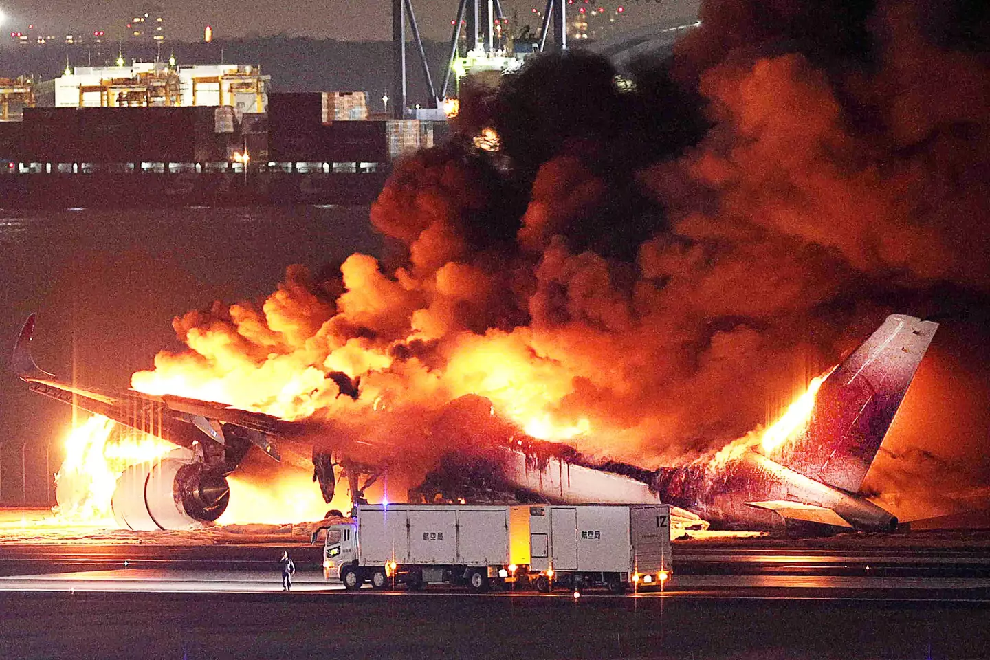 The plane was on fire on the runway, though all on board were able to evacuate.