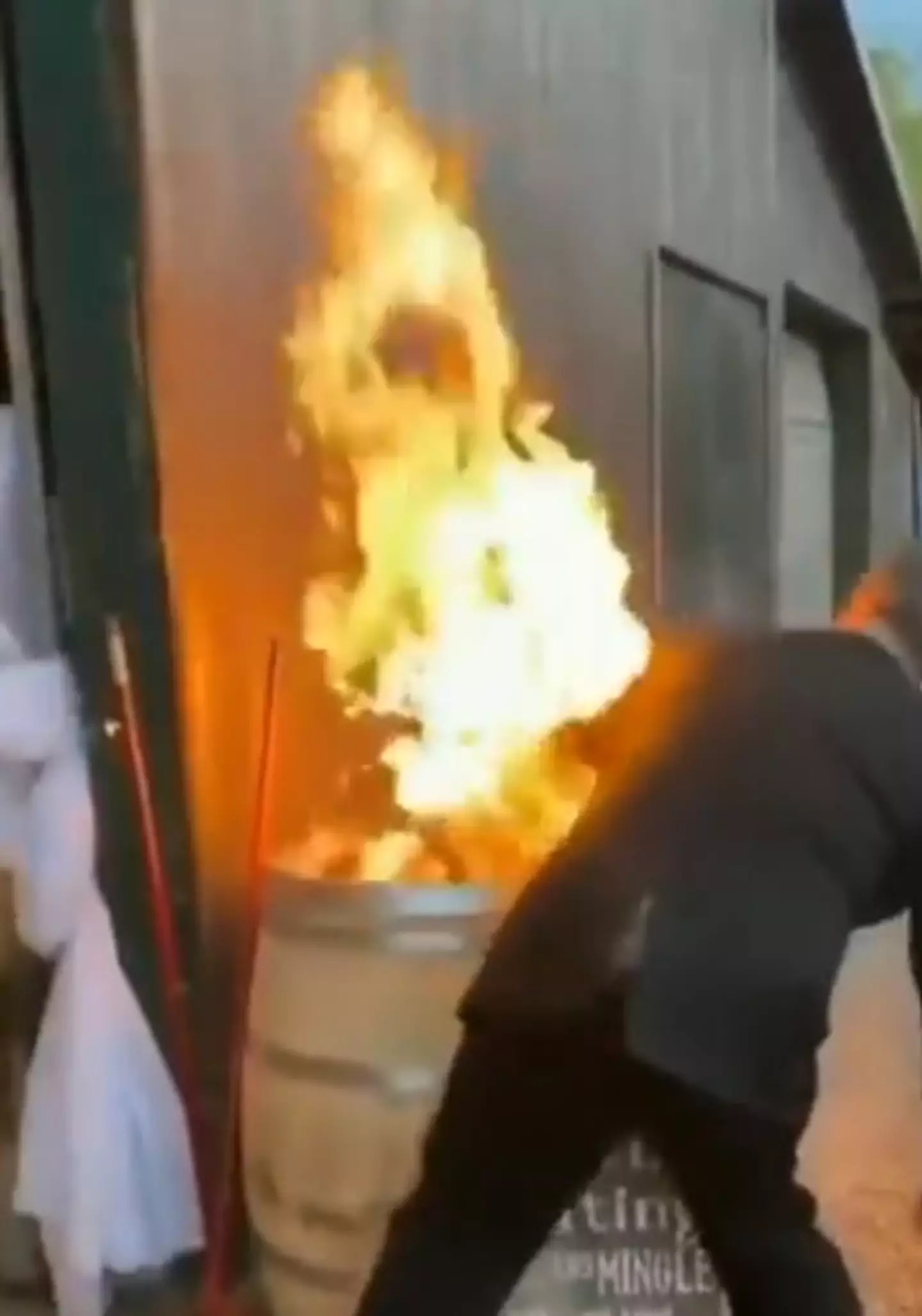 The gentleman tried to put the fire out with his arm.