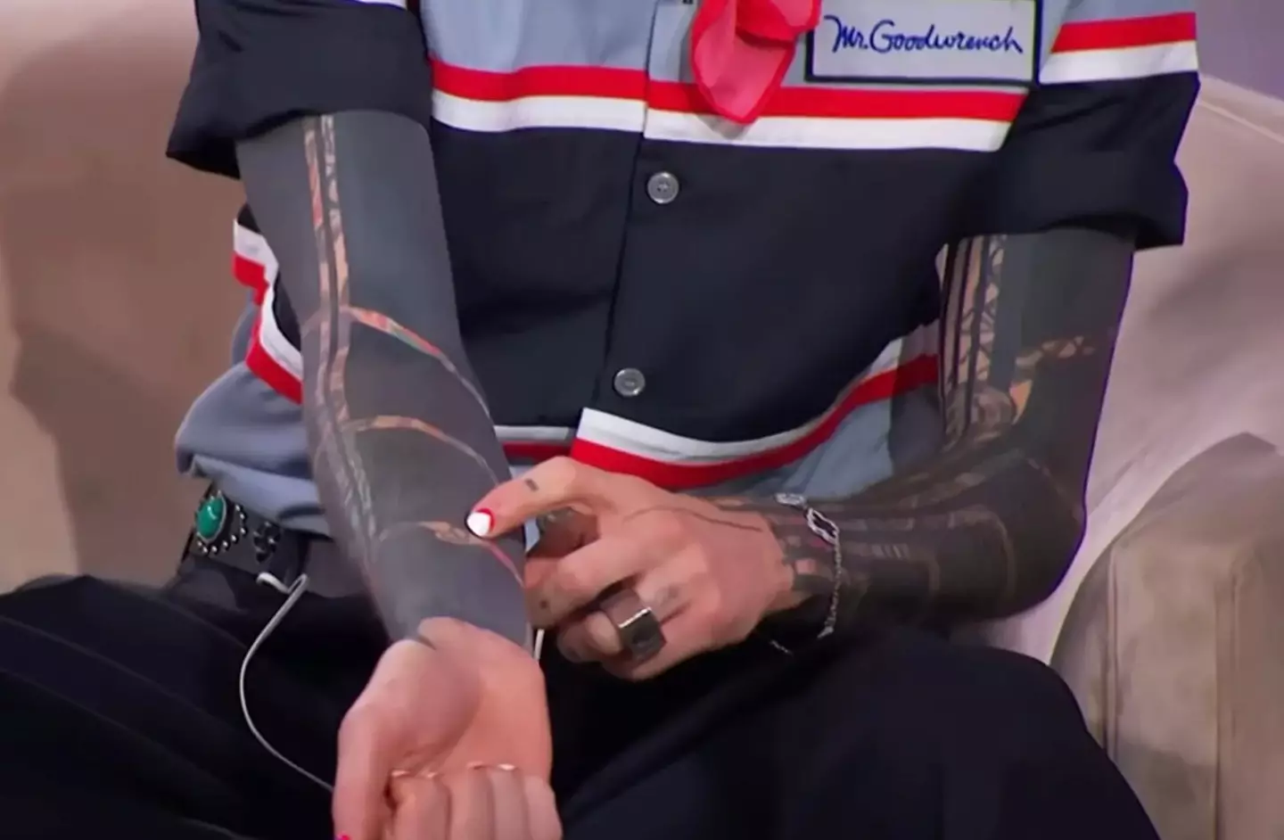 MGK explained he kept some special tattoos visible, such as one inked on his arm by his teen daughter (The Jennifer Hudson Show/Warner Bros)