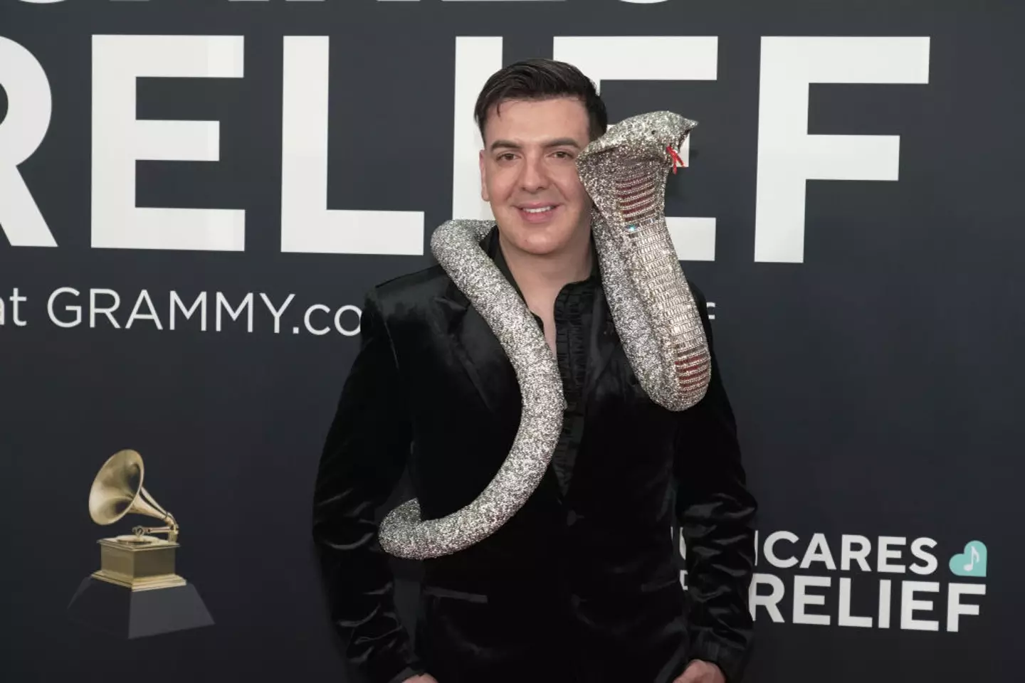 He was joined on the carpet by a glittery snake (Jeff Kravitz/FilmMagic)