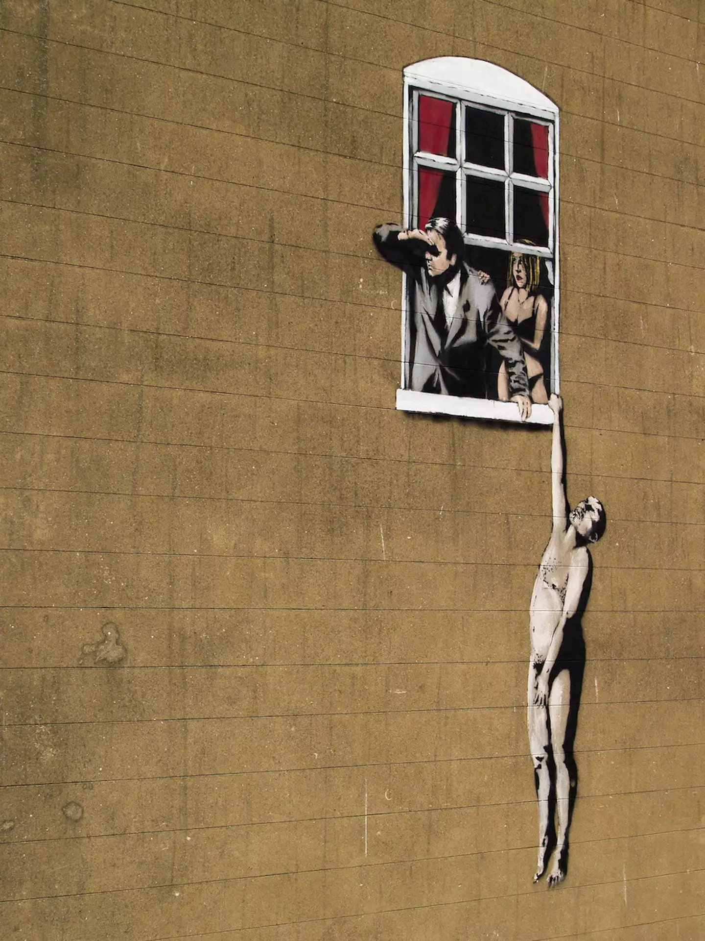 A graffiti design by the mysterious Banksy in Bristol, England.