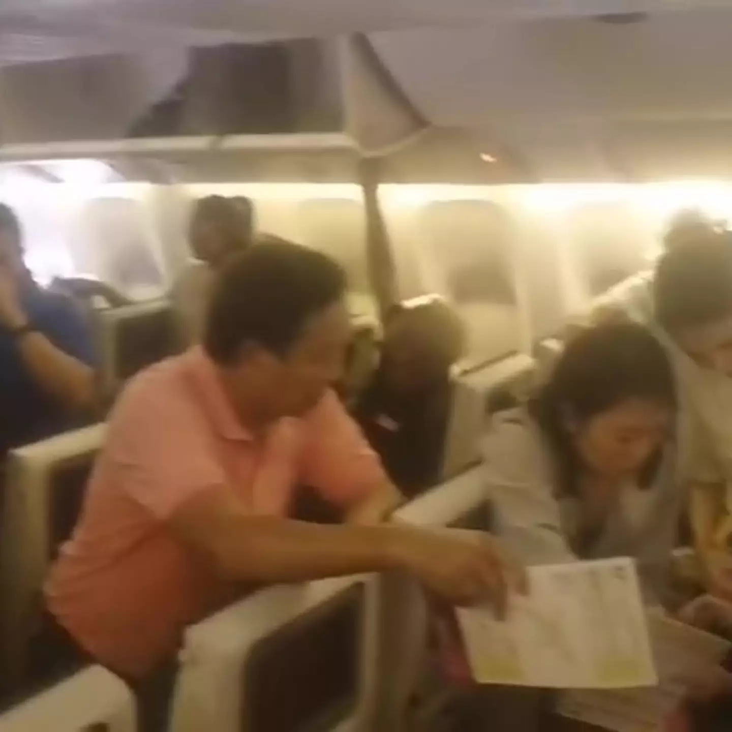 Passengers were made to strip down and fan themselves to stay cool. (Jam Press)