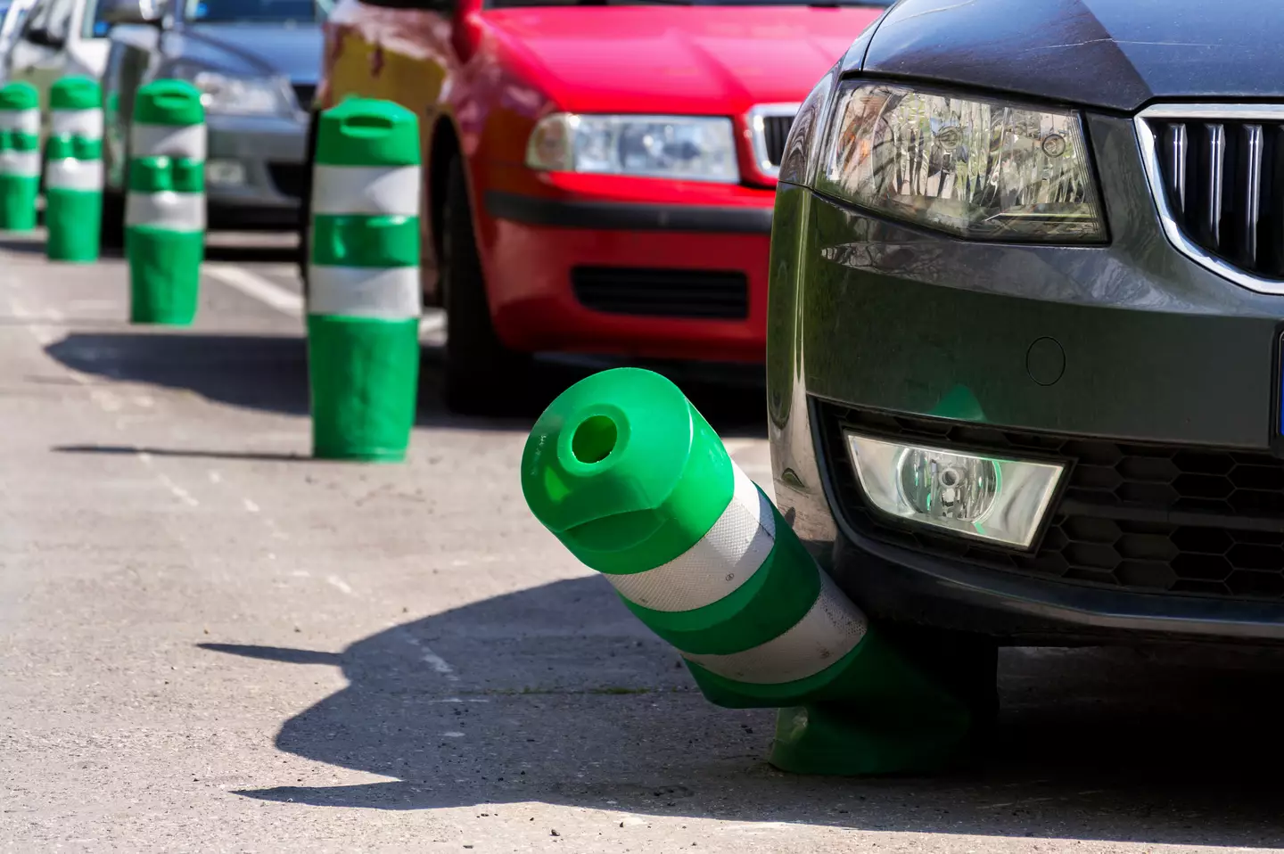 Car hitting green post