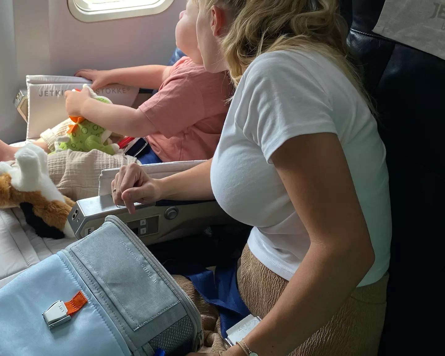 The mum was left to deal with three kids on the plane.