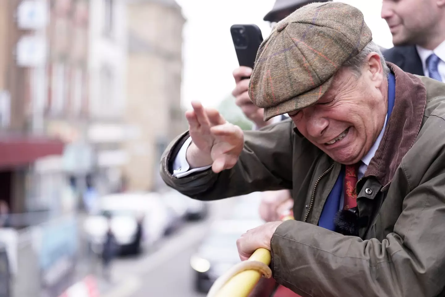 Nigel Farage had two objects thrown at him in Barnsley, both missed and he claimed one of them was wet cement. (PA)