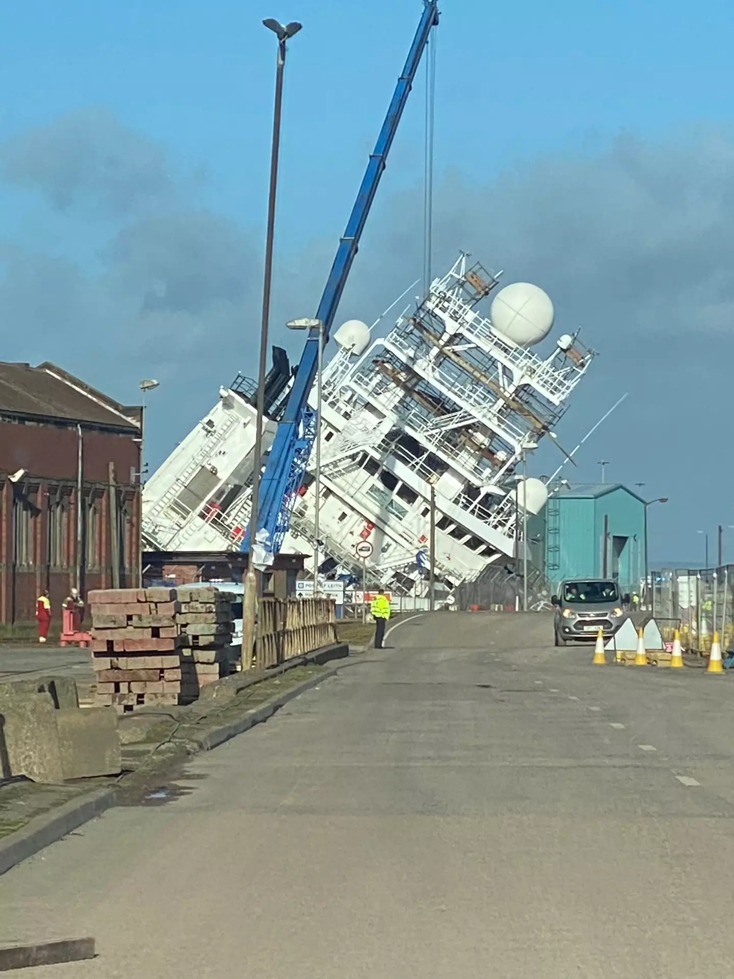 People have been injured after the research vessel Petrel toppled in the dock.