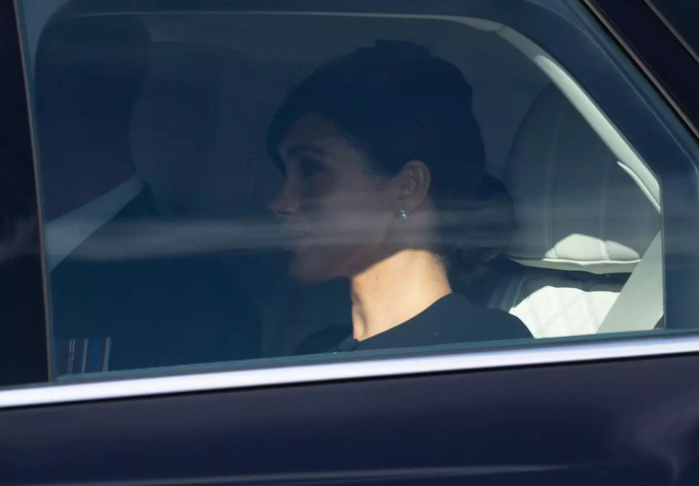 Meghan, travelling separately from Kate.