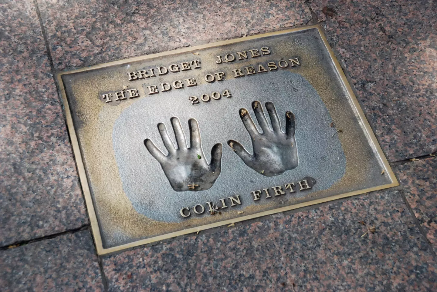 Colin Firth handprints in pavement commemorating the film Bridget Jones the Edge of Reason Leicester Square London.