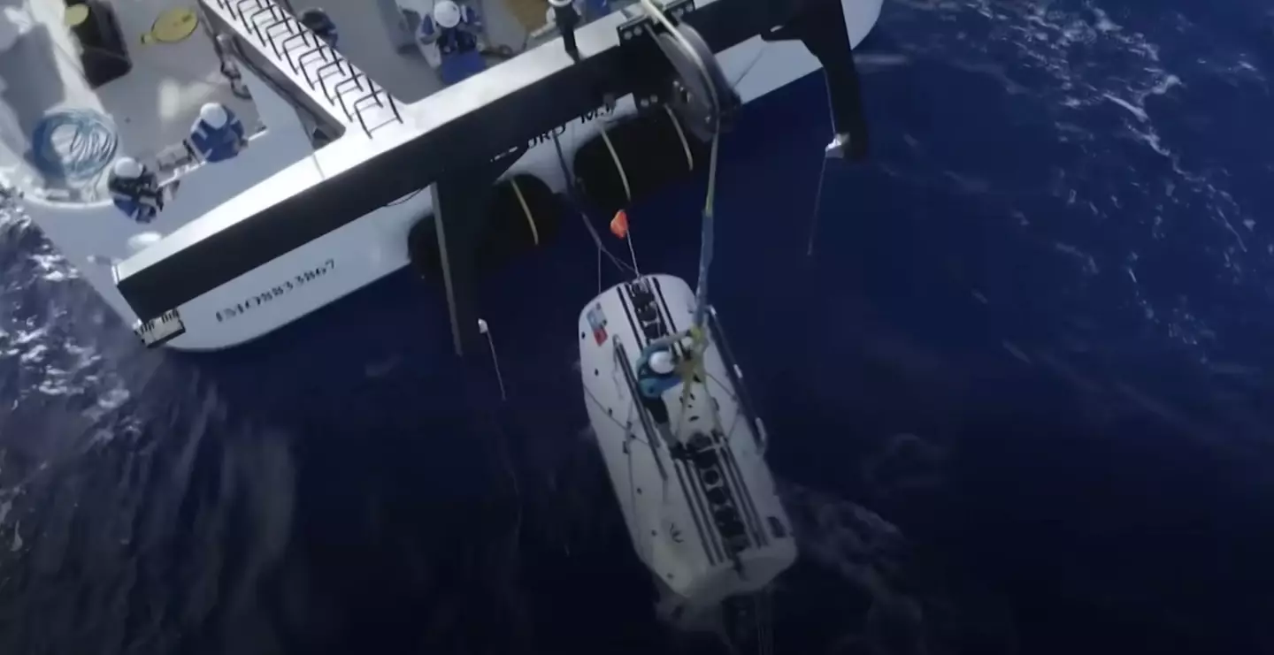 The DSV Limiting Factor seen being lowered off the support vessel named Pressure Drop (Atlantic Productions/Discovery Channel)