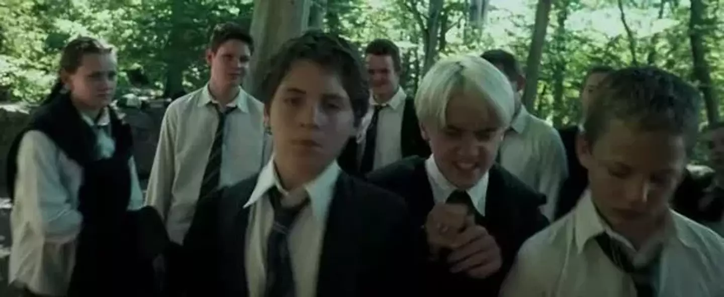 Tom Ackerley is the student on the left pushed out the way by Draco (Warner Brothers)
