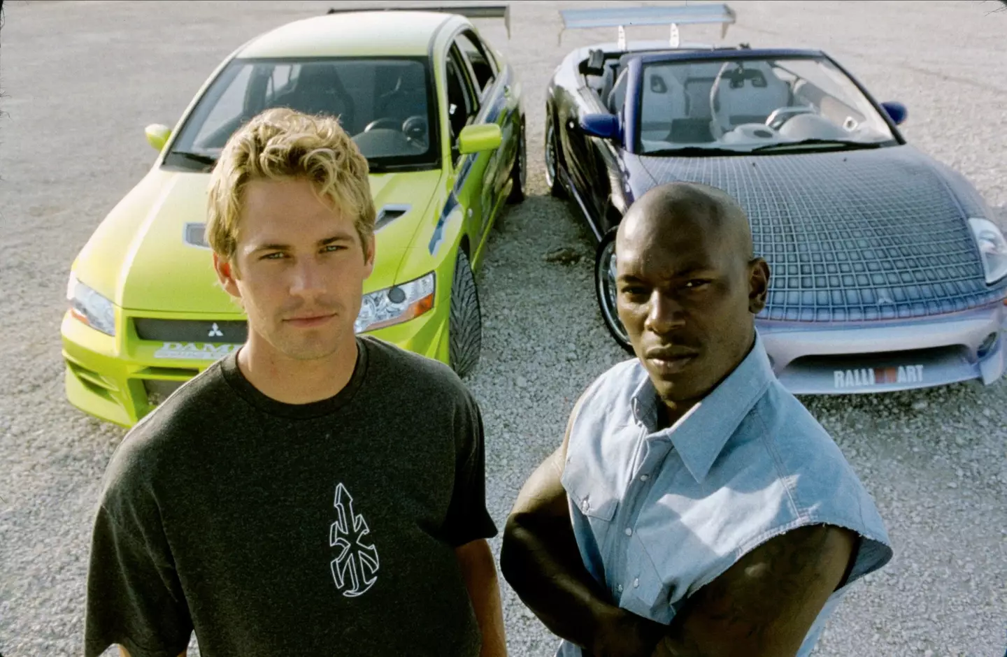 Walker and Gibson on the set of 2 Fast 2 Furious in 2003