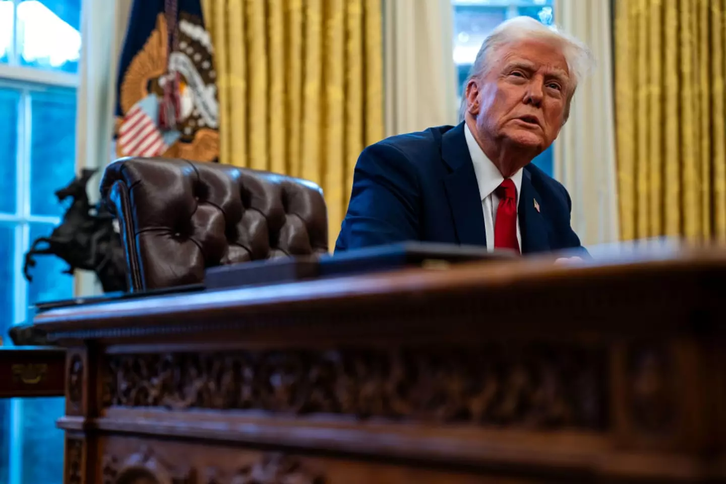 The president then put his foot in it with a controversial joke about visiting the crash site (Kent Nishimura for The Washington Post via Getty Images)
