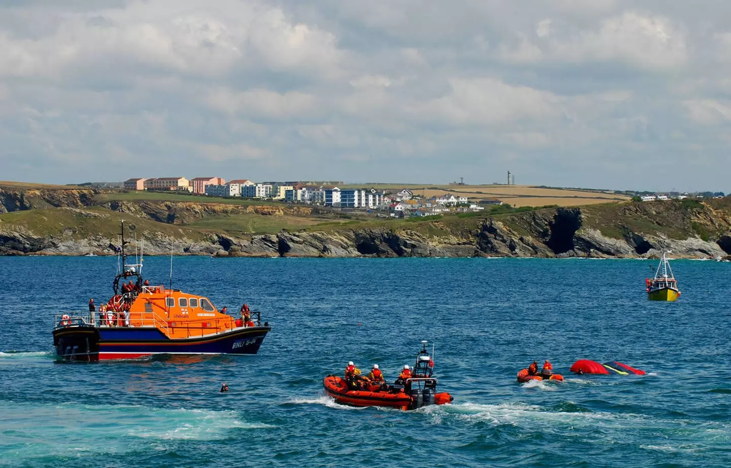 Lifeboat rescuing people off the coast of Newquay, Cornwall.