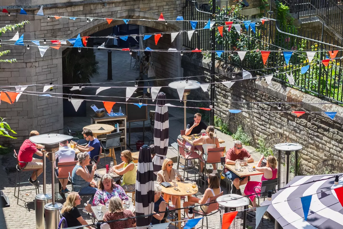 Brits love a beer garden, with millions of pounds being spent on booze in the summer months (Getty Stock Images)
