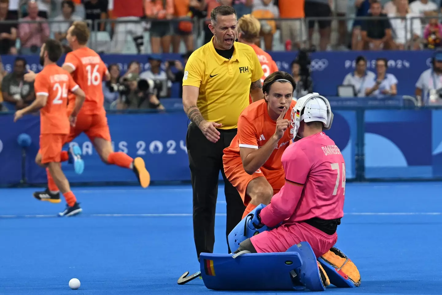 Duco Telgenkamp shushing the German goalkeeper (ARUN SANKAR / AFP via Getty Images)