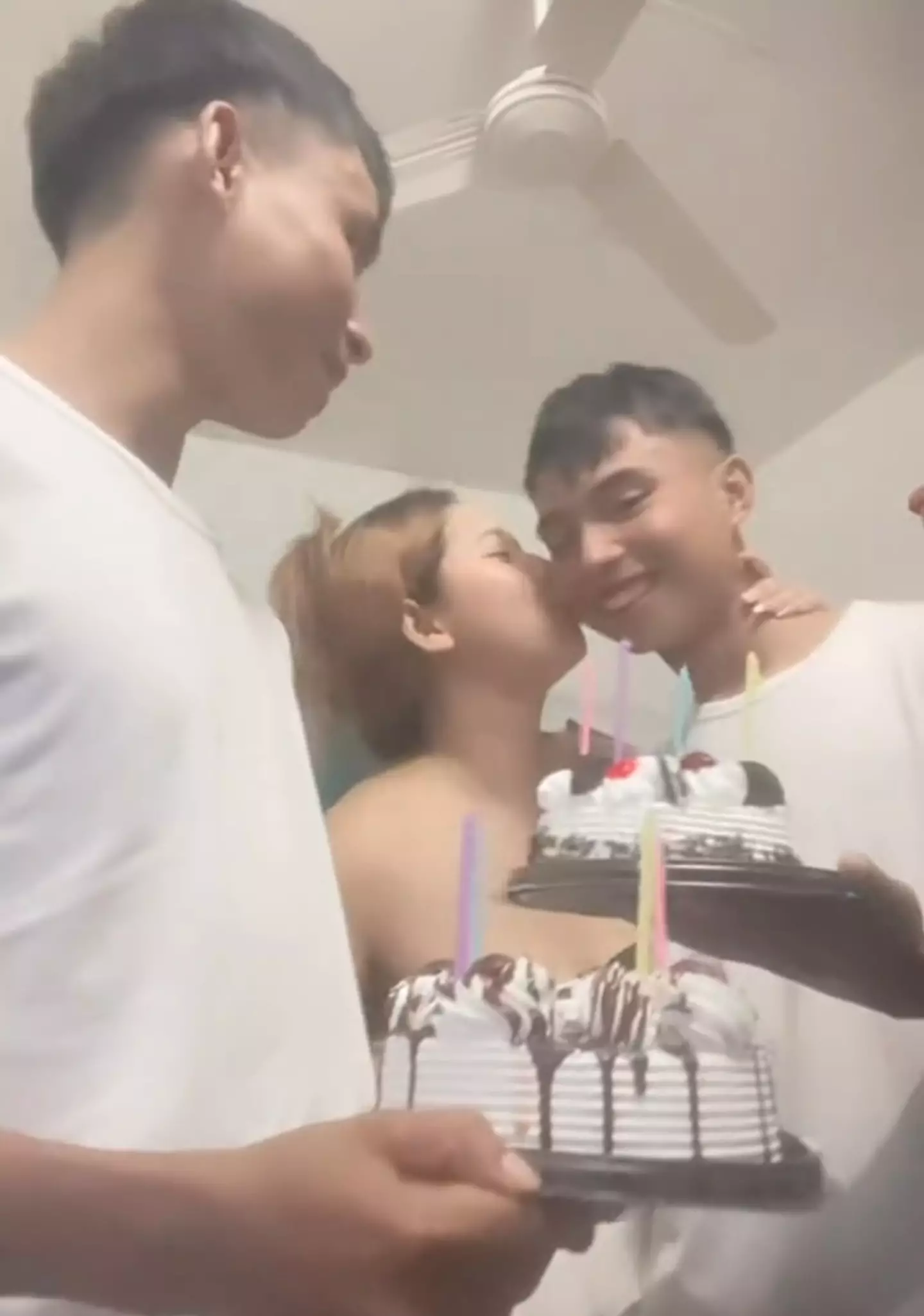 The 24-year-old claims the siblings don't argue over her and says they are all 'happy' with their arrangement (TikTok/@hoylaa44)